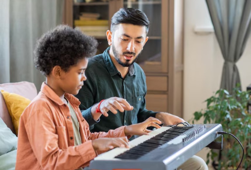 A Zera Music student learning to play the piano